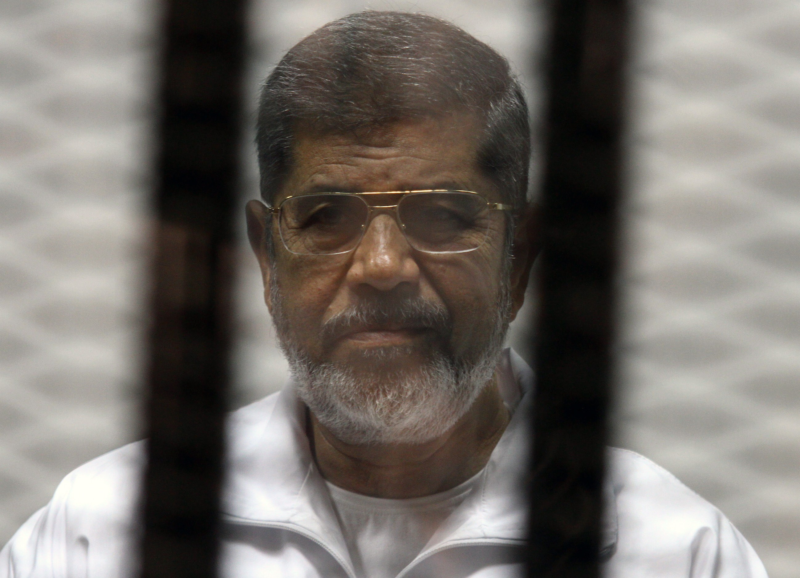 نتيجة بحث الصور عن مرسي بالزي الازرق في السجن