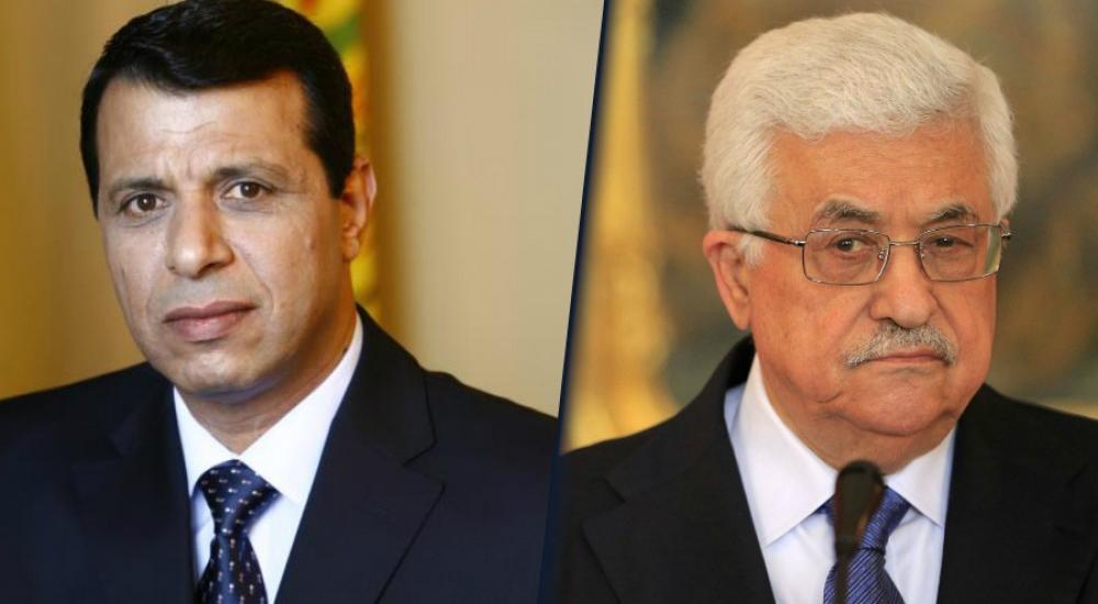 الرئيس محمود عباس (يمين) والقيادي المفصول من حركة فتح محمد دحلان