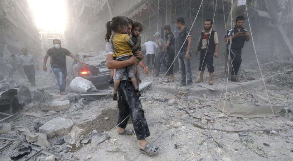 منطقة تعرضت لقصف بالبراميل المتفجرة