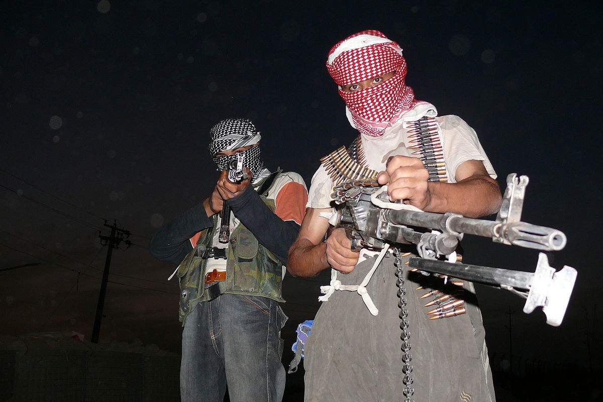 Iraqi_insurgents_with_guns,_2006.jpg